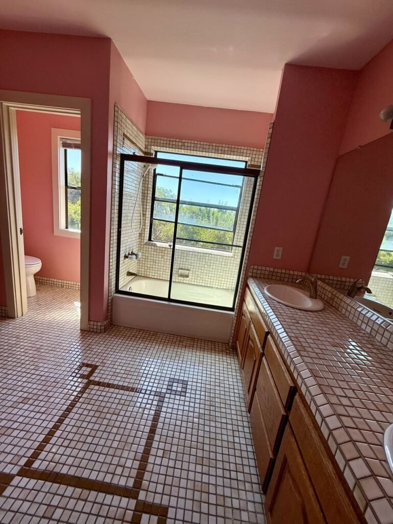 Before: dated pink mosaic tile bathroom on Highland Avenue