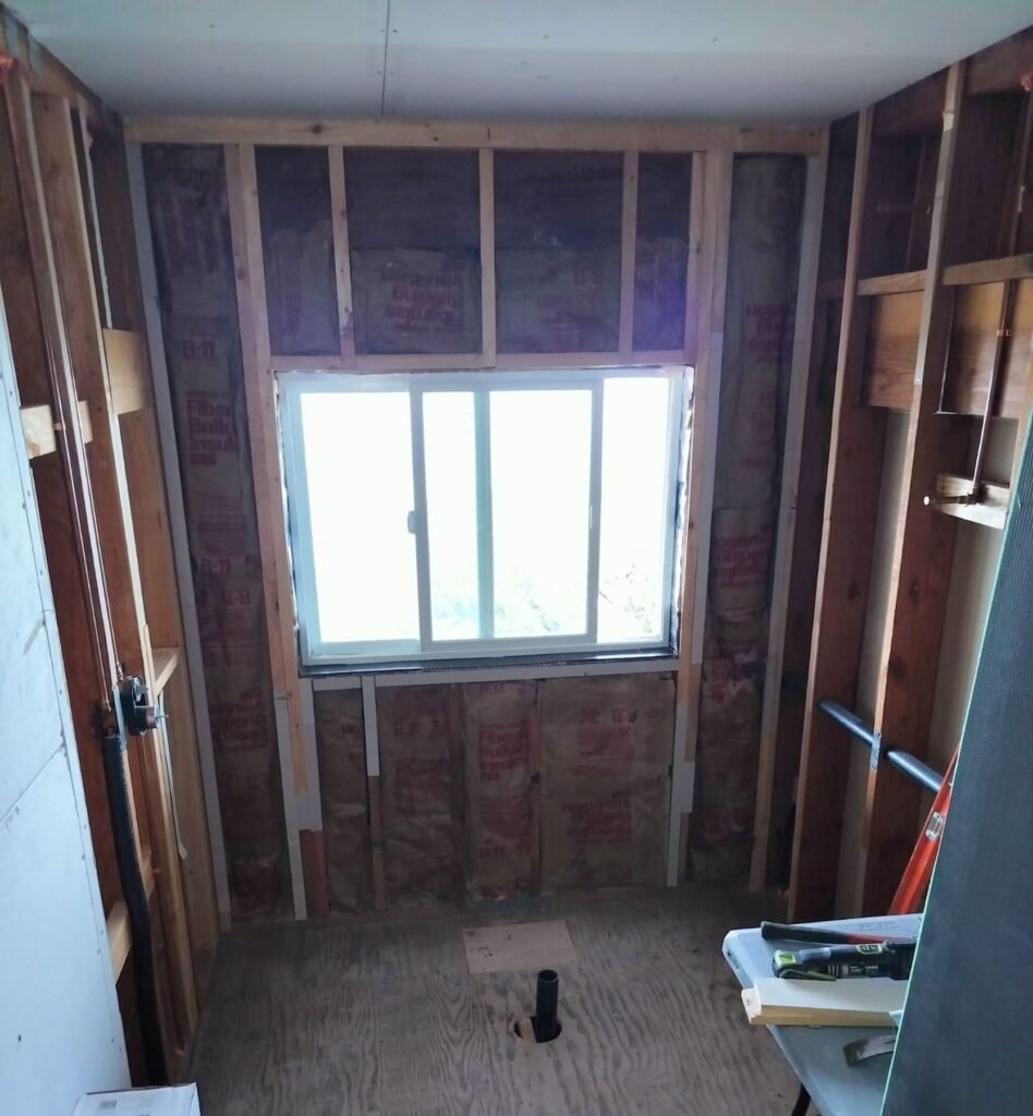 Before: Sugarloaf hall bath opened to framing