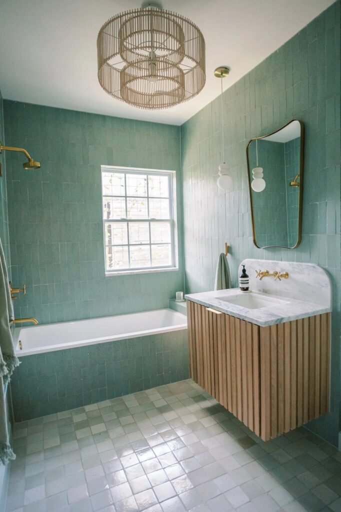 Bathroom wall in turquoise glazed thin brick tile with a handmade, zellige-inspired look
