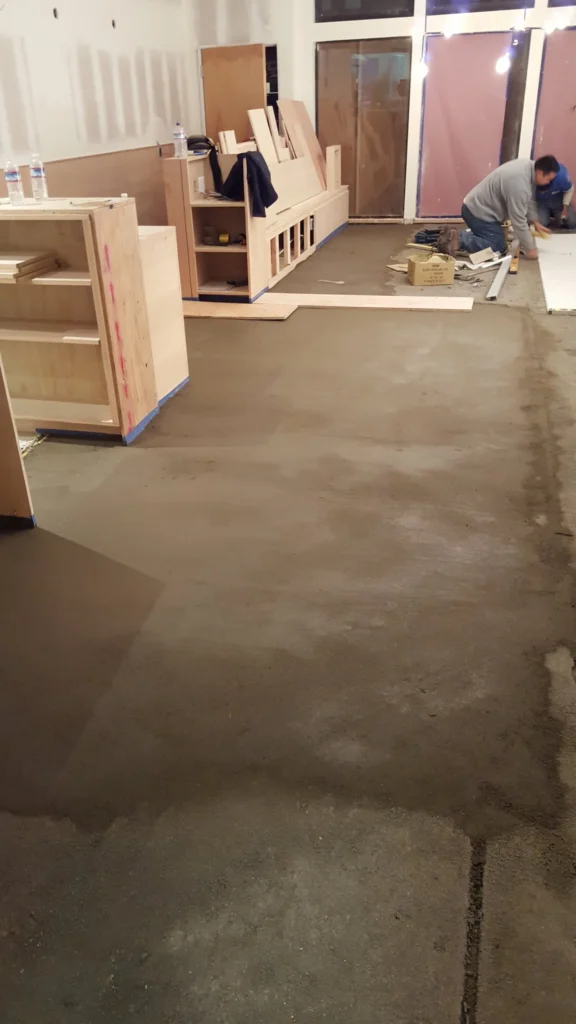 Commercial restaurant floor preparation before hexagon mosaic tile installation at Fiorella on Clement Street.